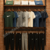 Single Panel Wall Mounted Garment Display Rack with Wooden Shelves and Matte Black Frame